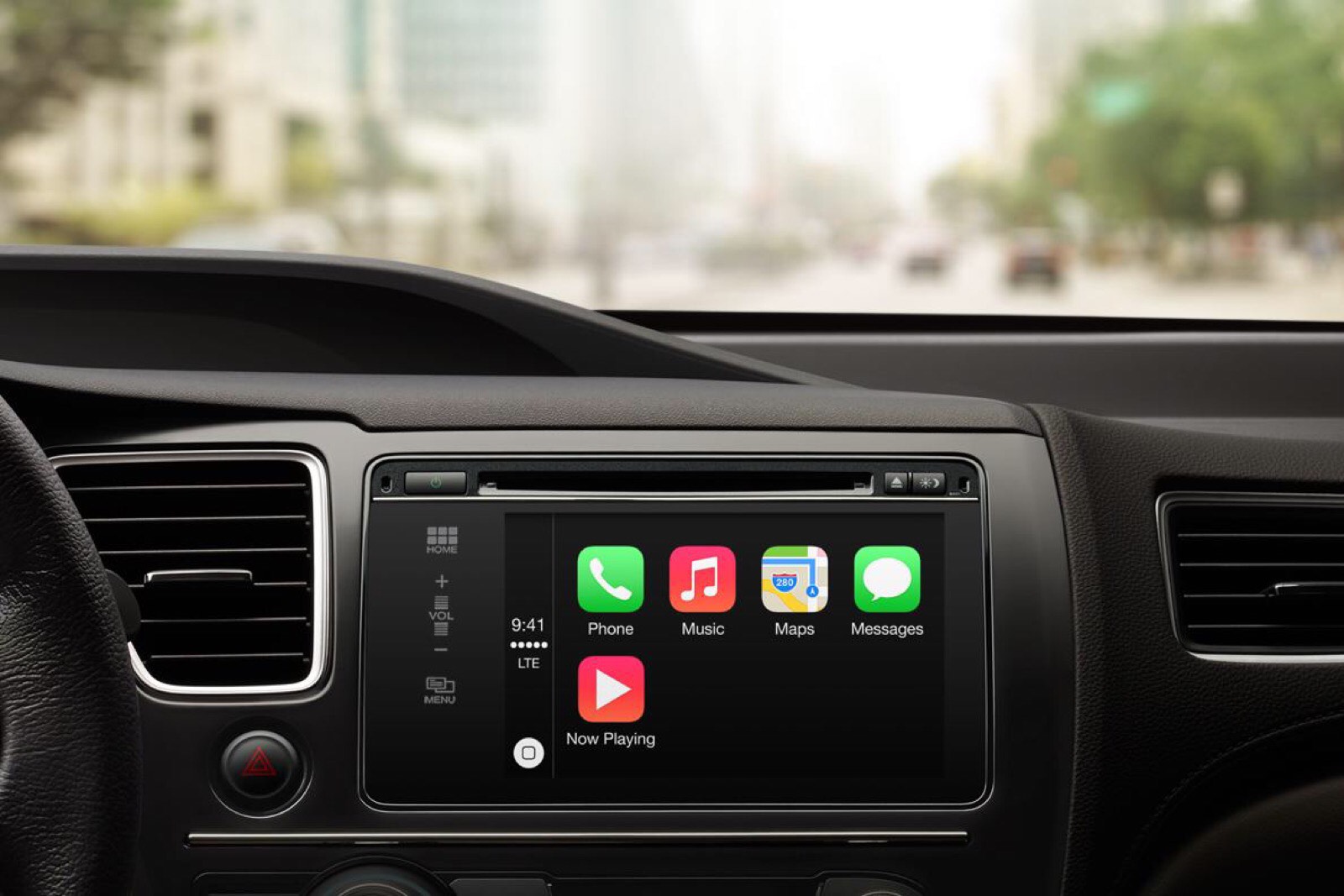 Apple's marketing image showing a car interior with the CarPlay dashboard