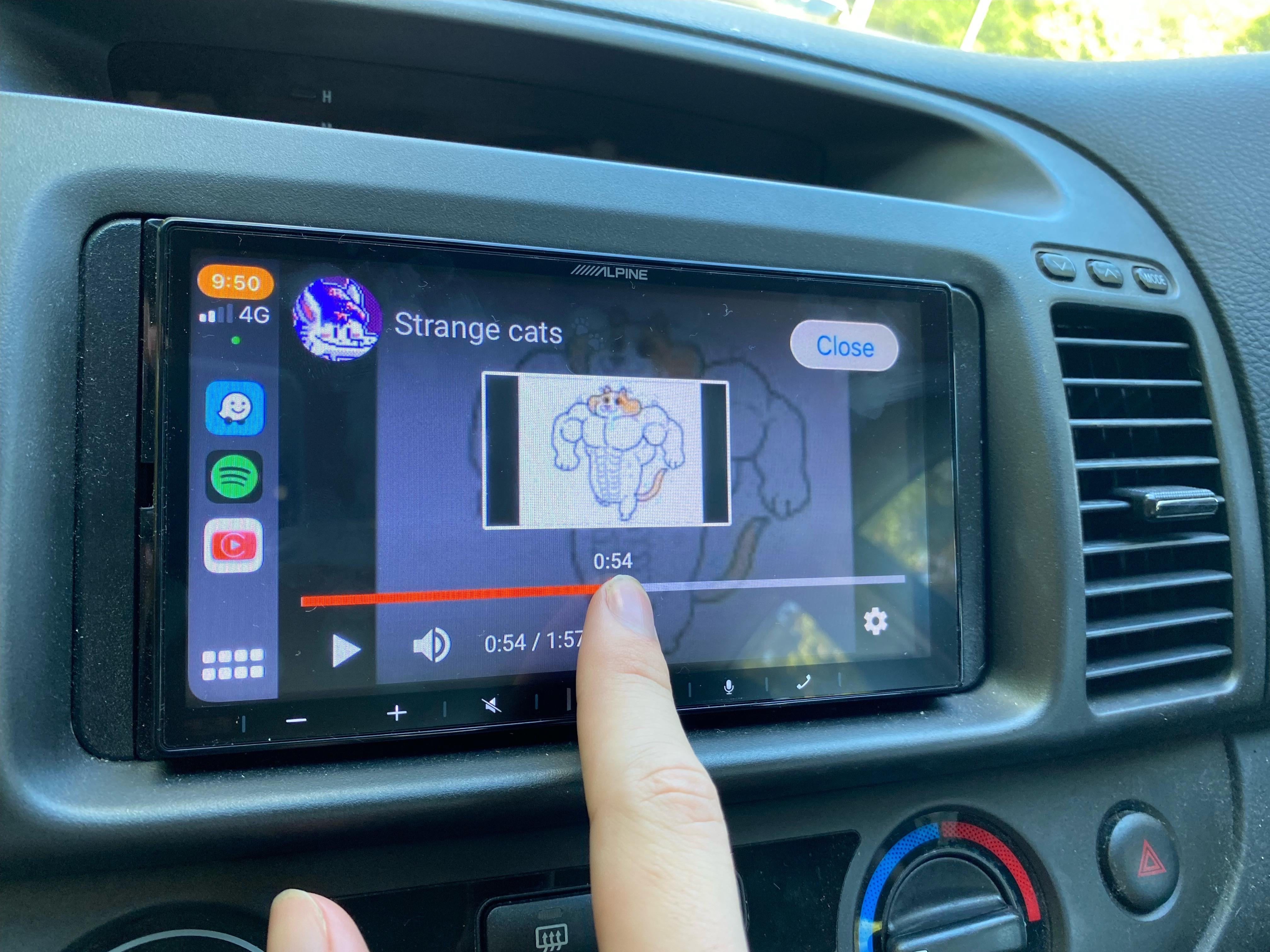 Operating YouTube via CarPlay with the CarTube for TrollStore app.